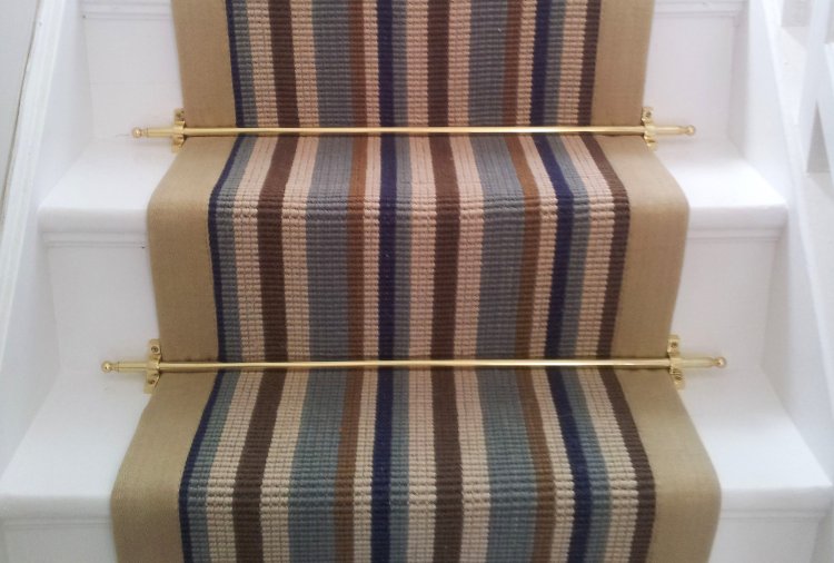Solid Brass Stair Rods securing a stripped stair runner.